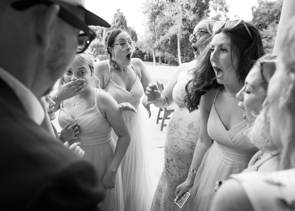 Wedding guest reactions in black and white
