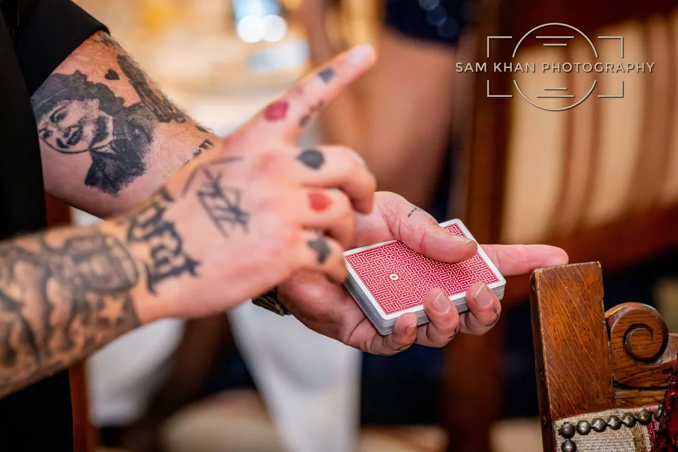 Phil holding a deck of cards at an event