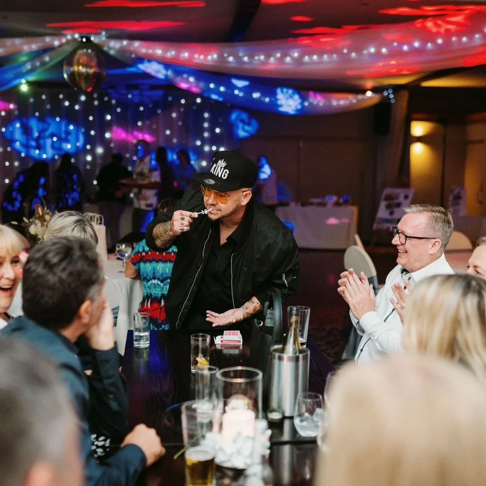 Guests applauding Phil during close-up entertainment
