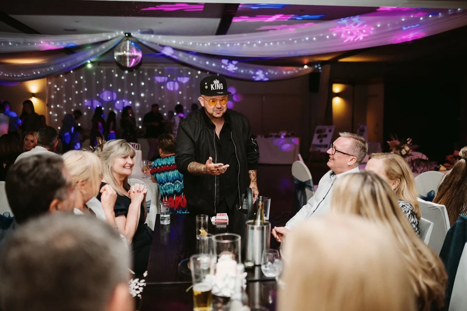 Phil performing close-up magic at a corporate event