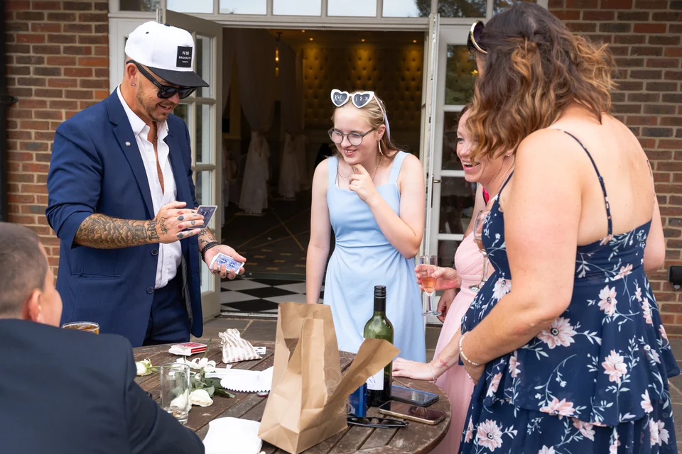 Guests reacting to Phil’s close-up magic at a private event