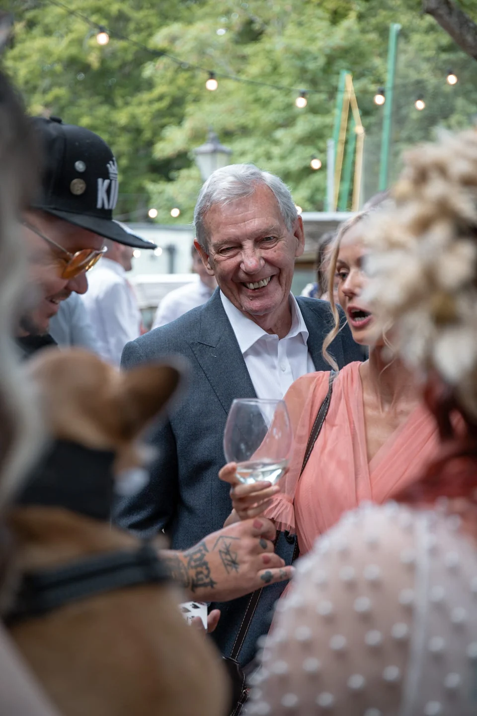 A guest reacting to Phil Pearson at a corporate event