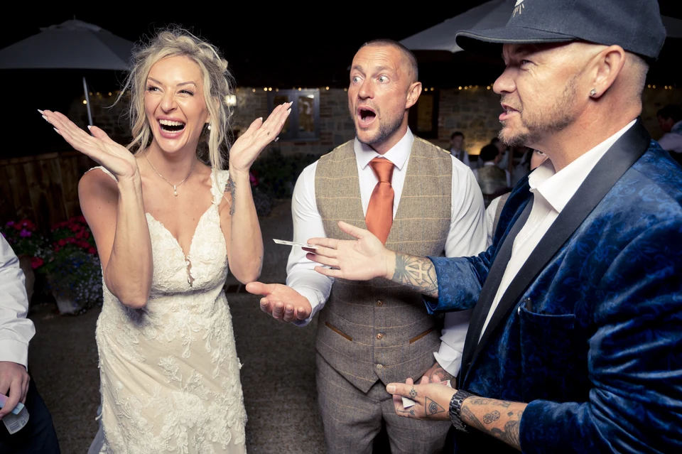 Bride and groom reacting to Phil Pearson’s wedding magic