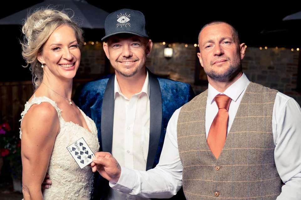 Phil pictured with a bride and groom